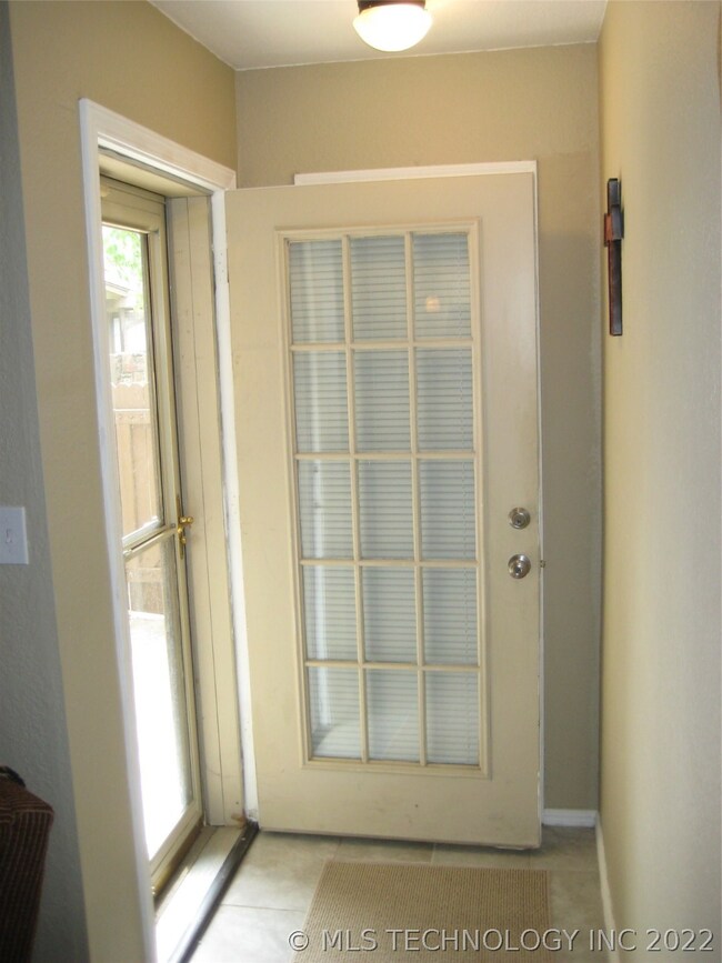 Storm Door & Entry Closet behind Front Door