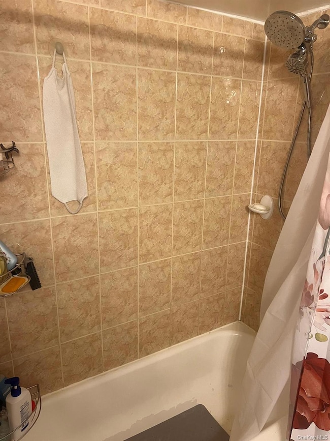 Bathroom with shower / tub combo