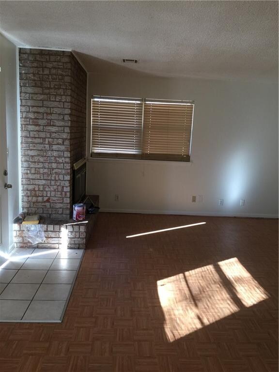 living area features a wood burning fireplace