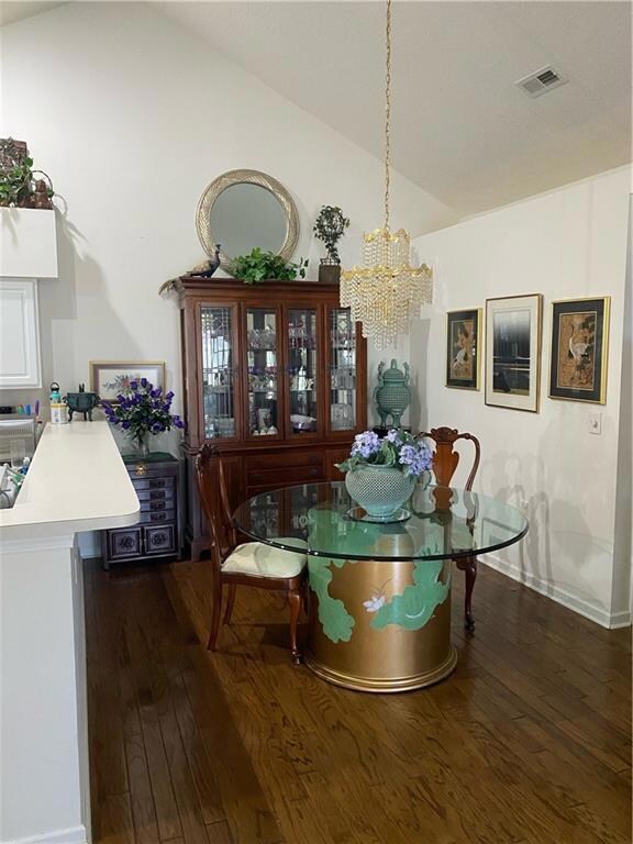 Dining space featuring an inviting chandelier, vis