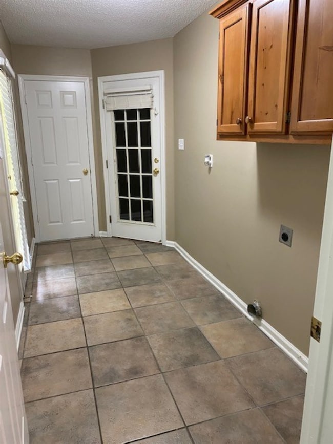 Look at this mud room combination laundry room conveniently located off the garage entrance and rear yard!