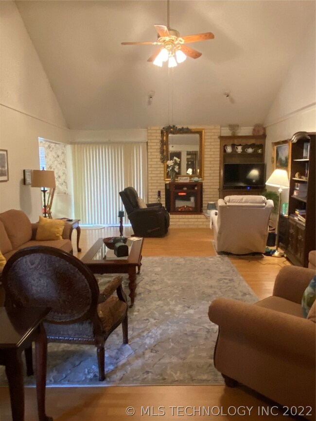 LARGE LIVING AREA WITH WOOD BURNING FIREPLACE