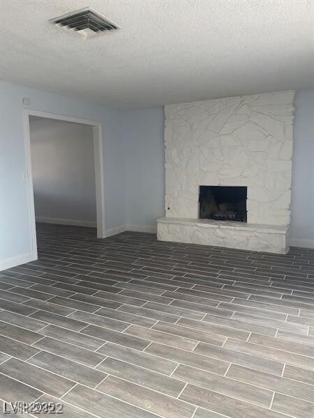 Unfurnished living room with wood finish floors, v