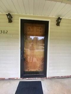 STORM DOOR ON ENTRY FROM COVERED PORCH