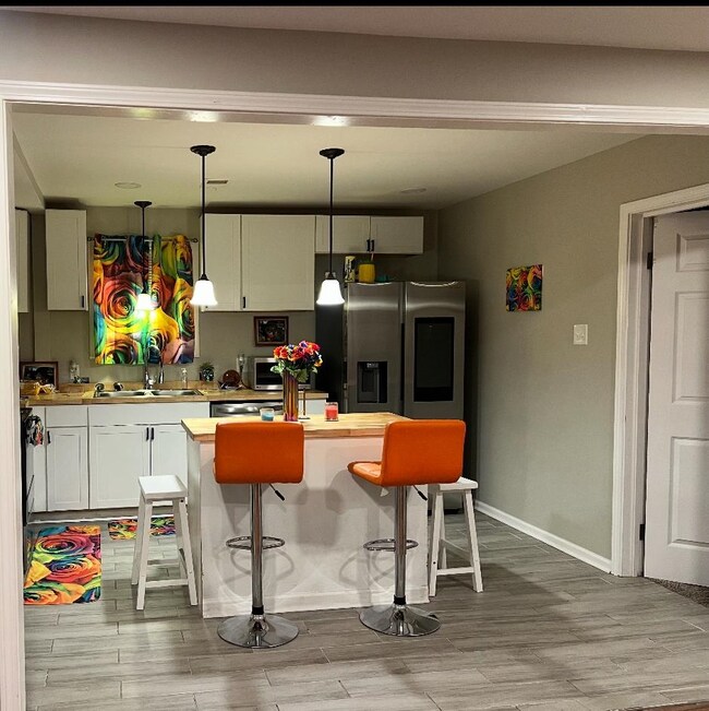 Kitchen with a breakfast bar, stainless steel frid