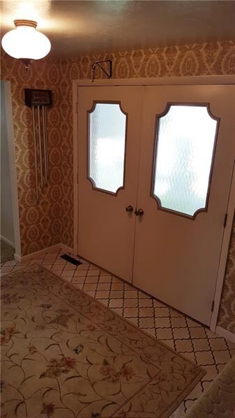 Front Entry with Ceramic Tile and Double Doors.