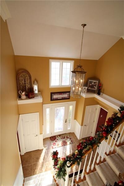 Two story foyer with two closets, newer ceramic ti