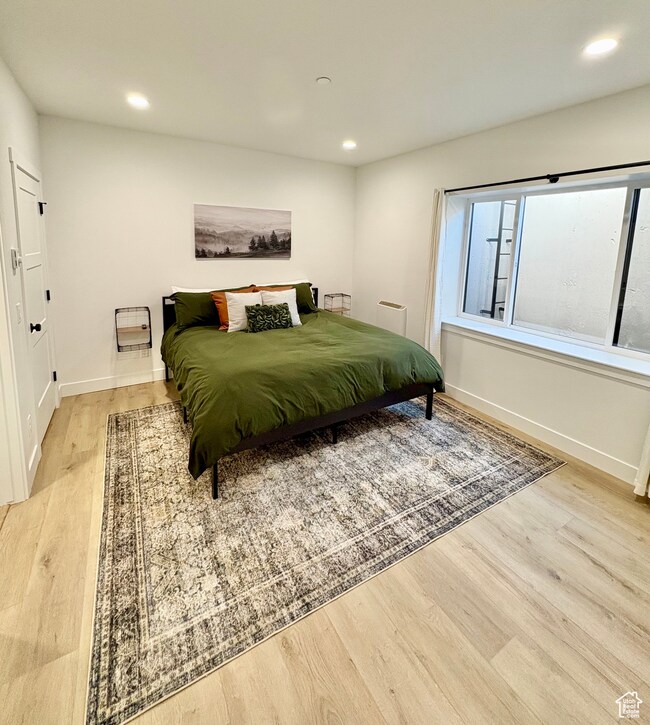 Bedroom featuring recessed lighting and light wood finished floors