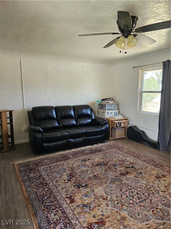 Living room with dark wood-style flooring and a ce
