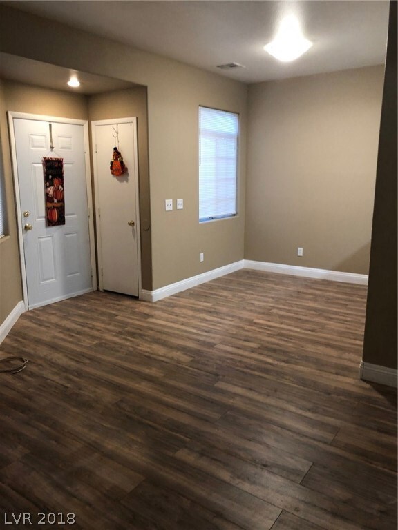 Living and dining nook with new flooring and two-t