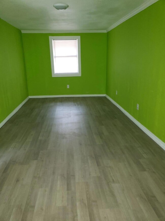 Unfurnished room with light hardwood / wood-style 