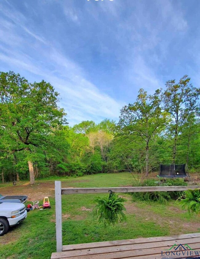 View of yard with a trampoline
