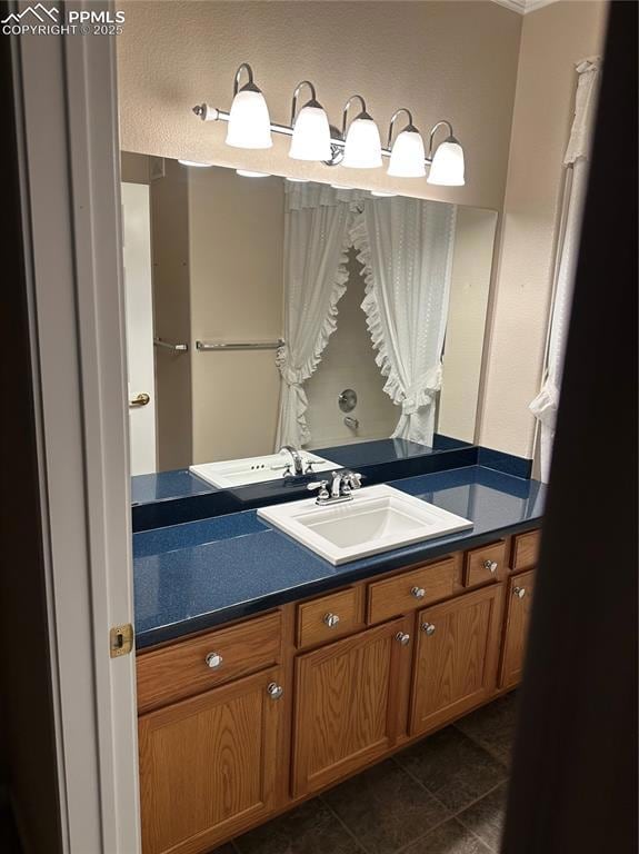 Bathroom with vanity and tile patterned floors