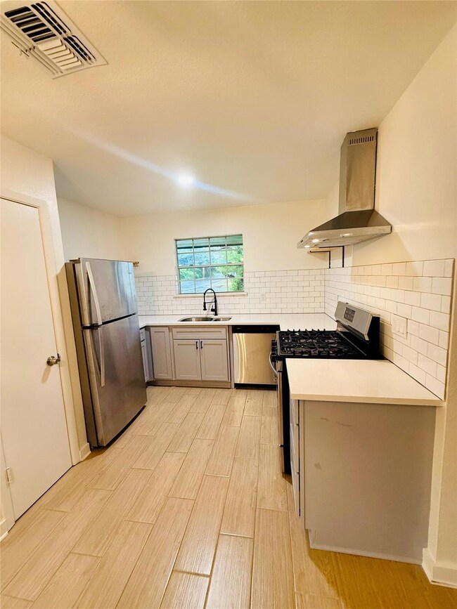 Kitchen featuring a sink, stainless steel applian