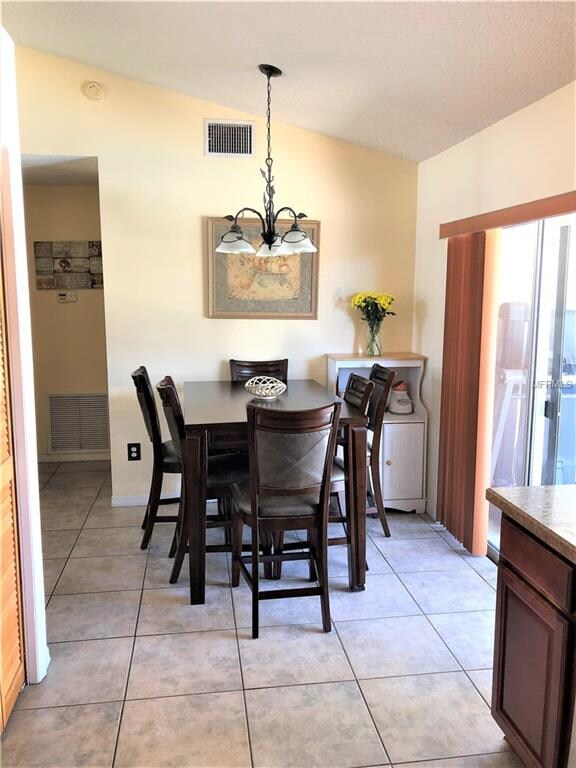 Dinette overlooks the large fenced-in back yard an