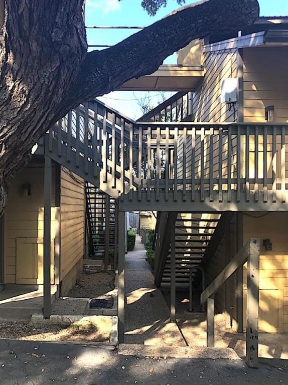 View of side of property with stairway
