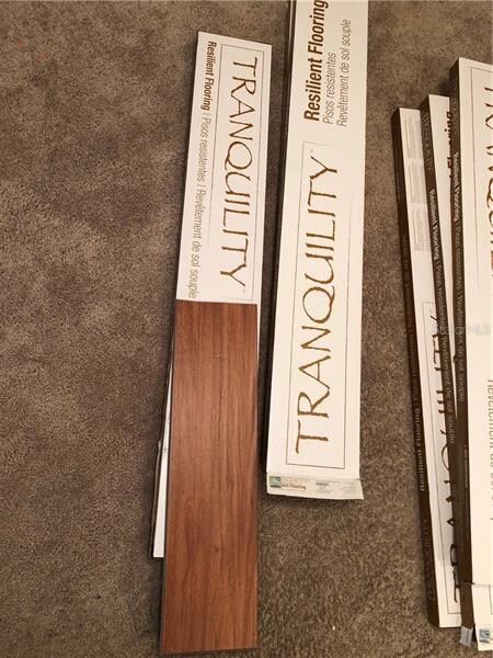 Composite flooring for kitchen.  Currently being i