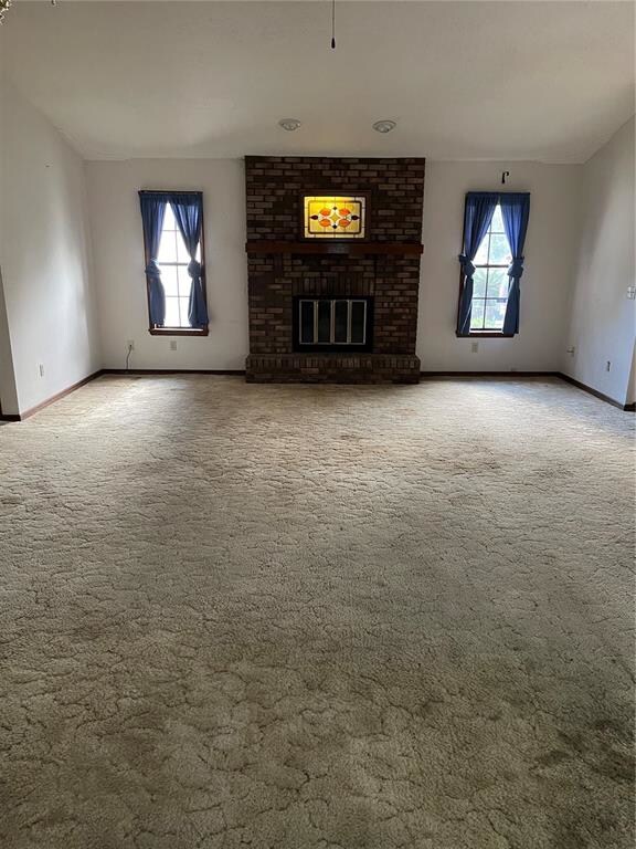 living room with wood burning fireplace
