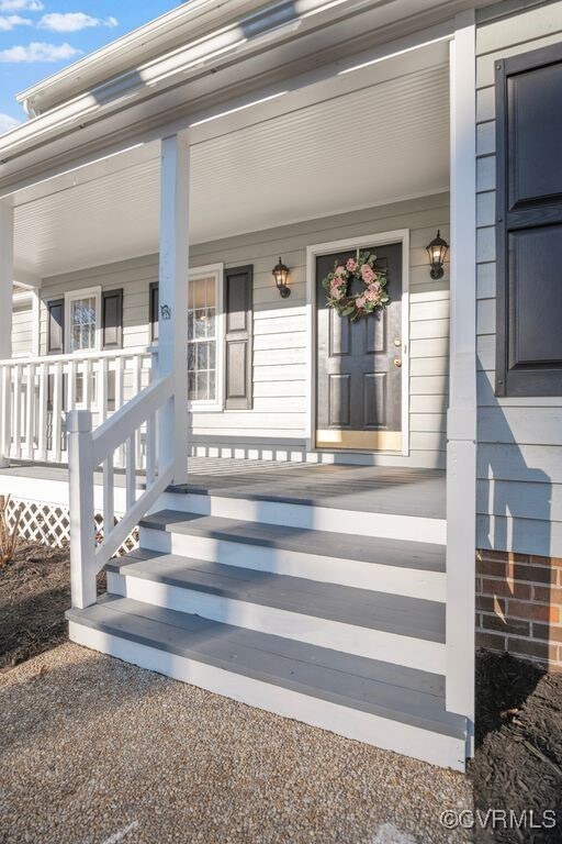 Property entrance featuring covered porch