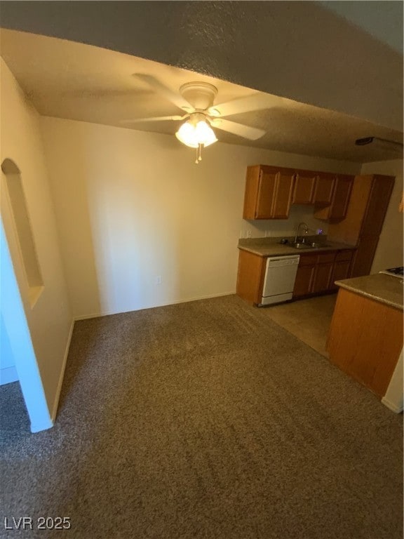 Kitchen with dishwashing machine, light carpet, a