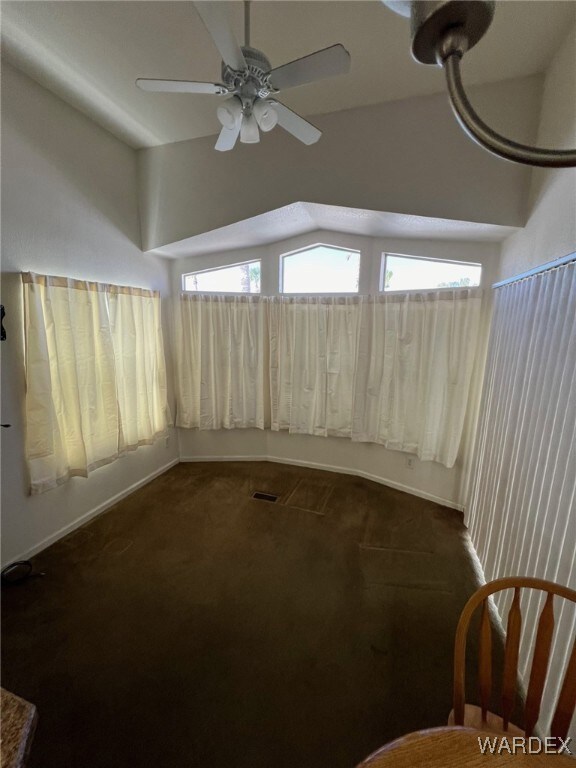 Unfurnished Living room featuring ceiling fan and