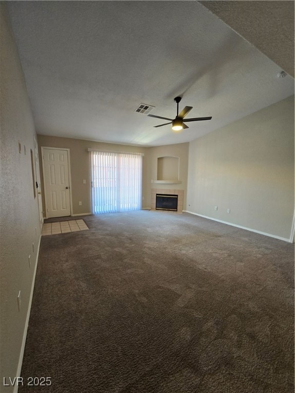 Unfurnished living room with a ceiling fan, a tile