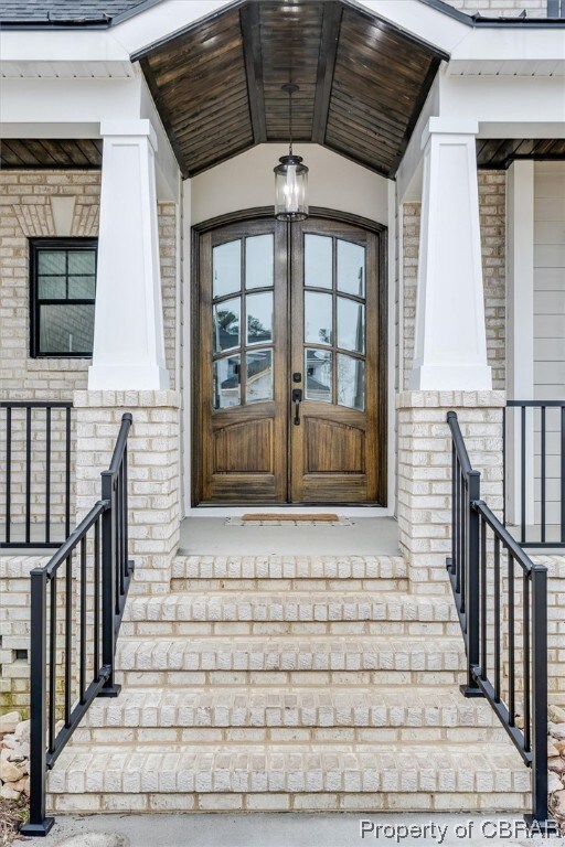 Entrance to property with custom french doors