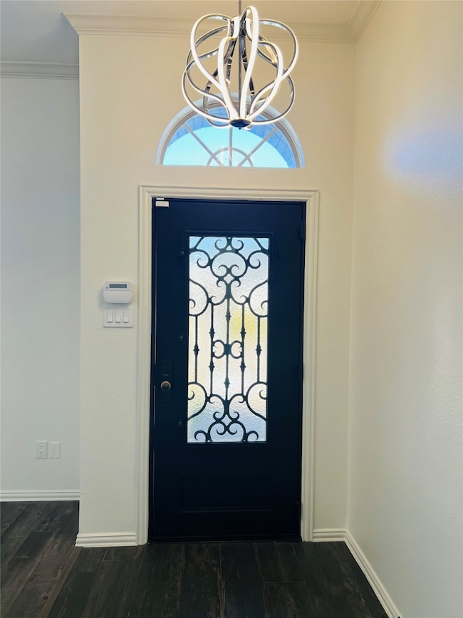 Welcoming foyer with ornamental molding