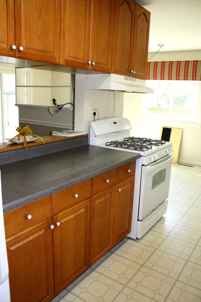 Kitchen has opening into family room.