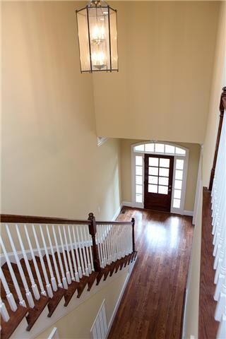 FROM THE FRONT DOOR YOU ARE WELCOMED INTO THE FOYER WITH GLEAMING HARDWOOD FLOORS.