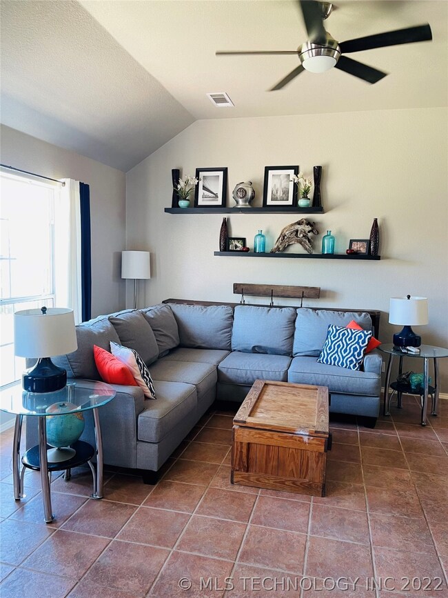 Living room has high ceilings and a spacious feel.