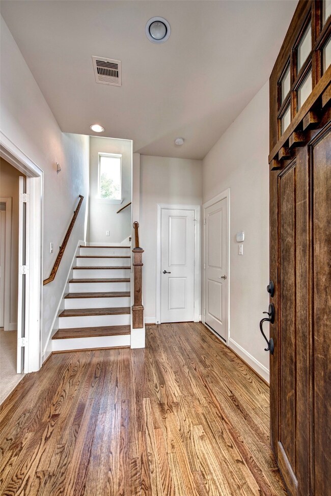 Entryway. 1st floor bedroom to the left. Door to garage to the right.