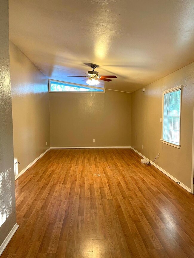 Spare room featuring wood finished floors, health