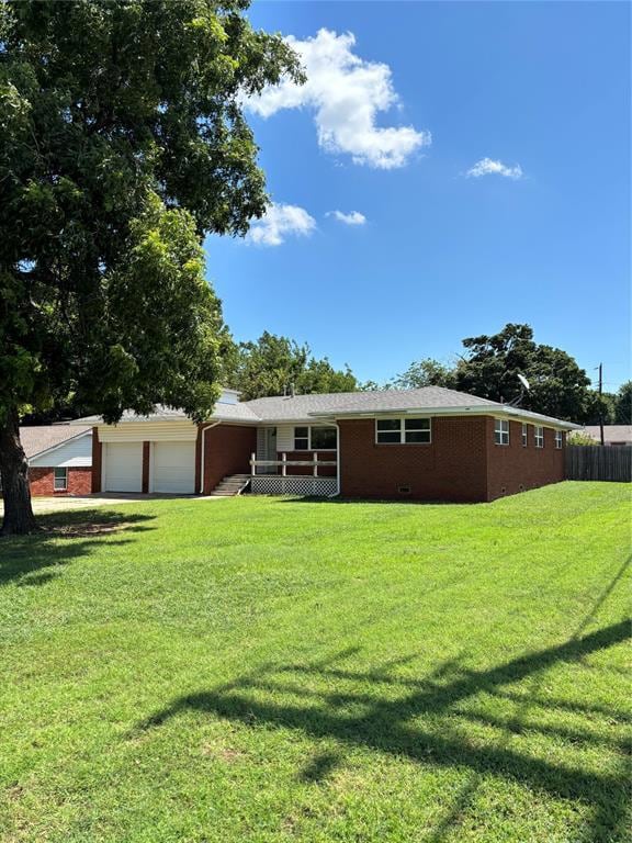 Back of property featuring brick siding and a garage