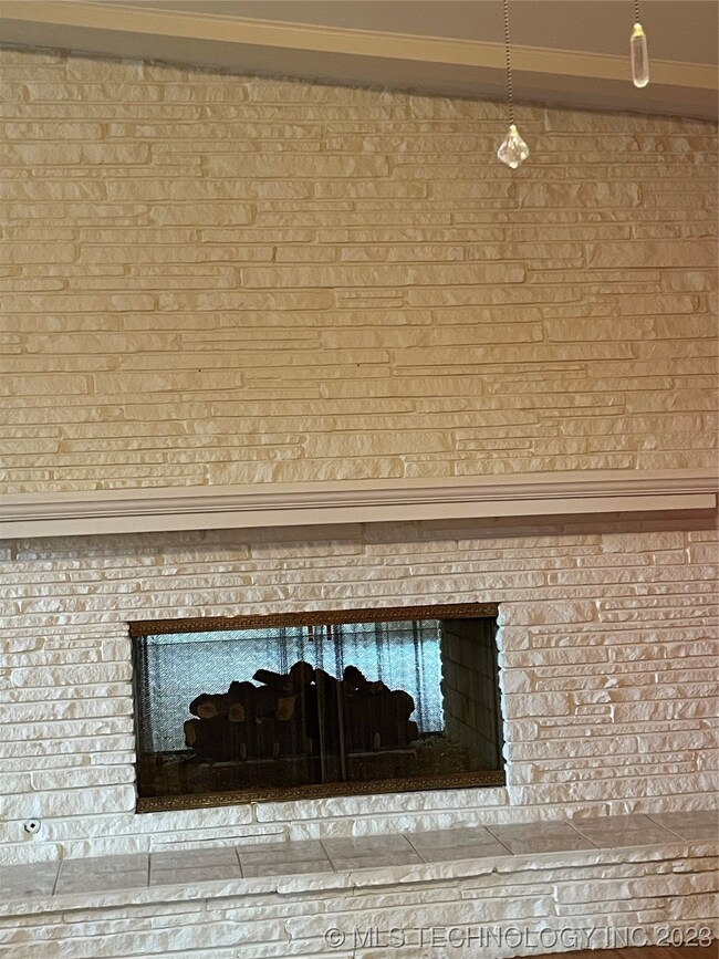 Living Room Firplace Opens to Den