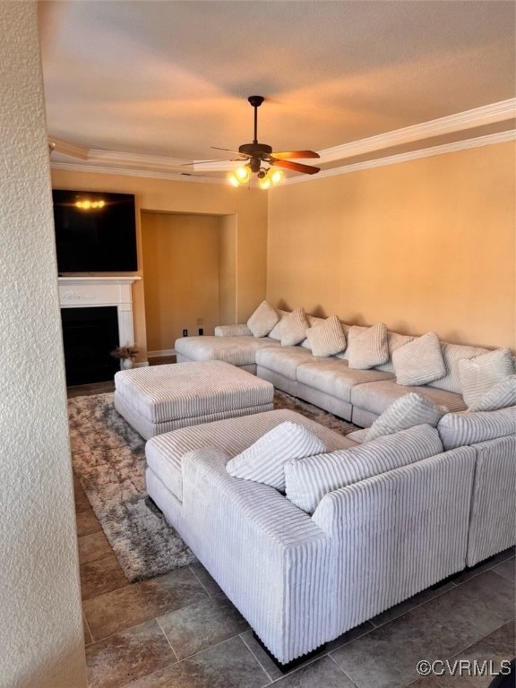 Living area featuring crown molding, a ceiling fan