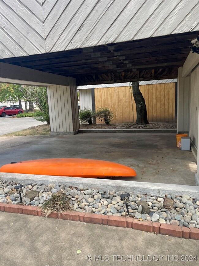 Personal carport with storage area