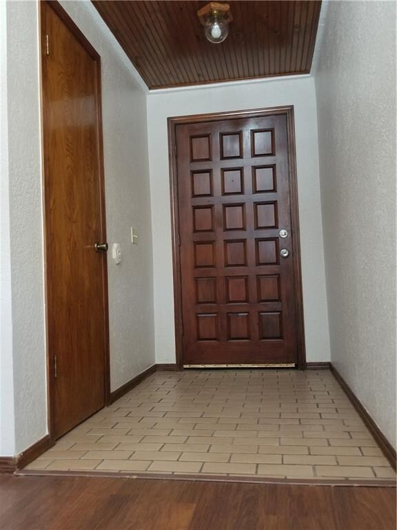 Beautiful Entry with Tiled Floor and Stained 18-Pa