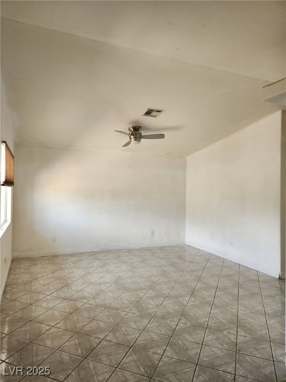 Unfurnished room featuring ceiling fan and baseboa