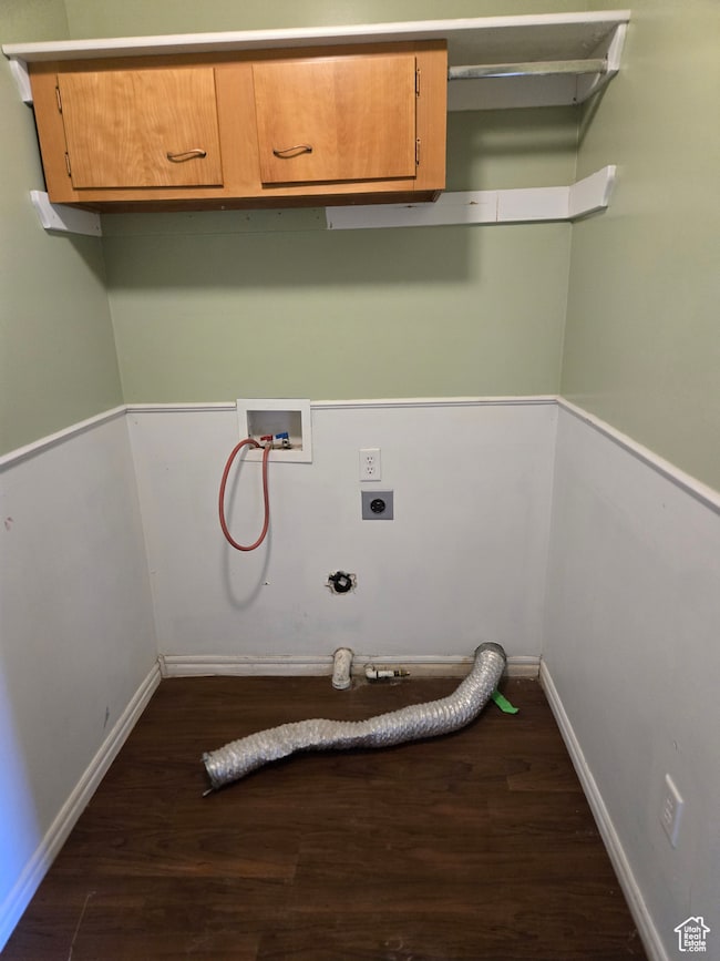 Laundry room featuring hookup for a washing machine, dark wood-style floors, cabinet space, and gas dryer hookup
