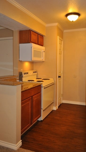 Kitchen featuring baseboards, ornamental molding,