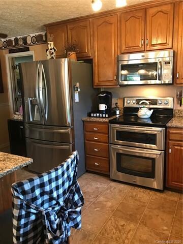 Kitchen with granite countertops and stainless steal appliances