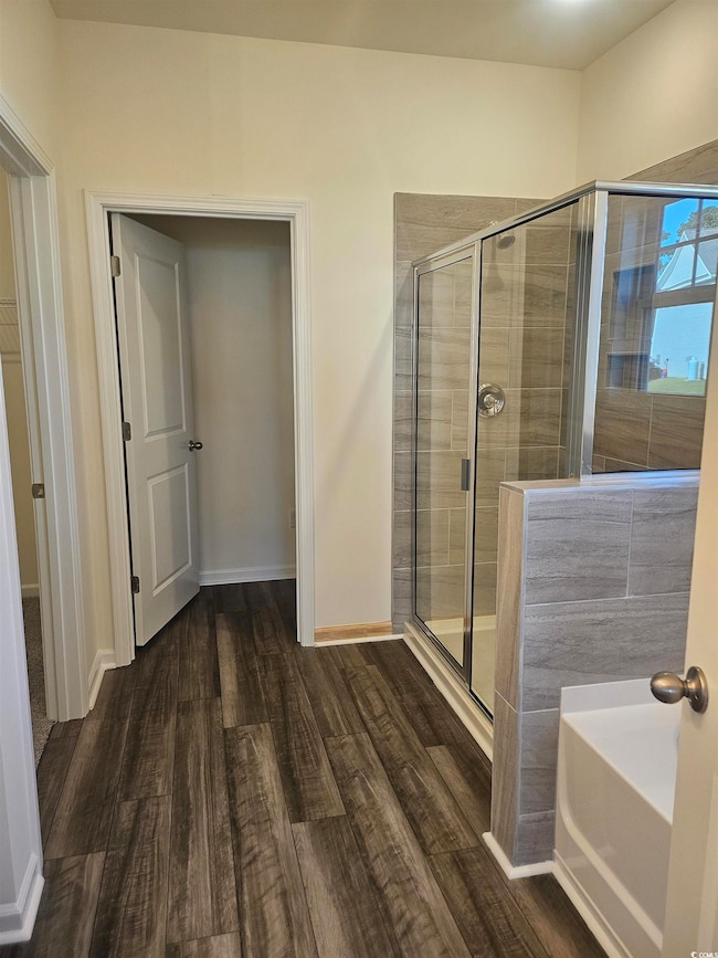 Actual photos of the primary bath featuring garden tub and seperate shower