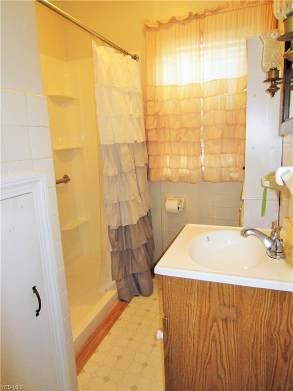 First floor full bathroom with walk-in shower.