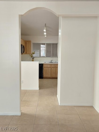 Kitchen featuring light countertops, black applian