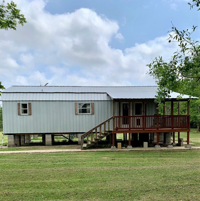 Huge front porch extends along the side as well