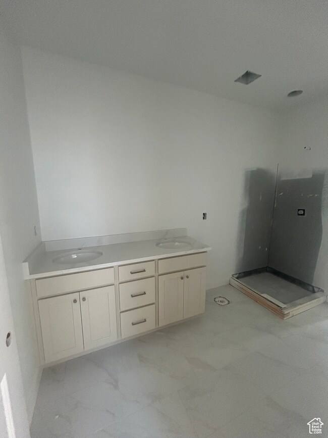 Full bathroom featuring double vanity