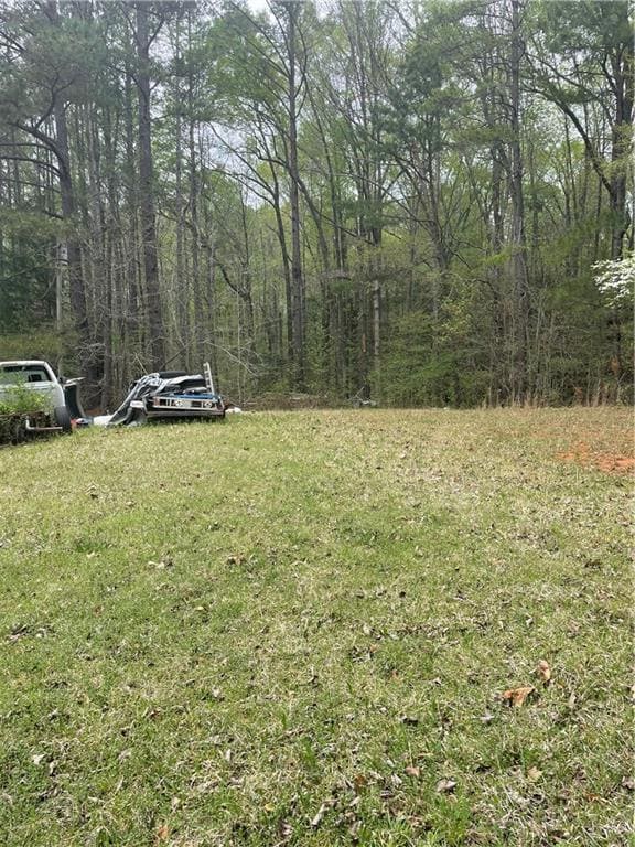View of yard with a forest view
