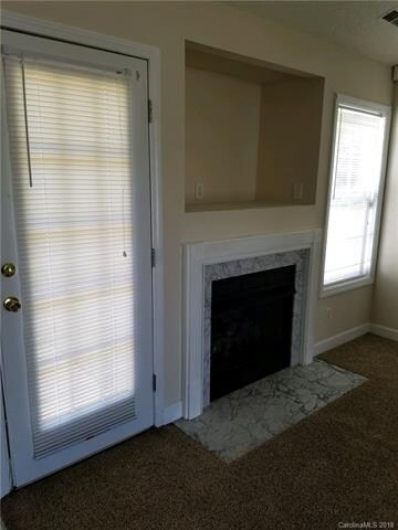 Gas log fireplace and entertainment niche in livin