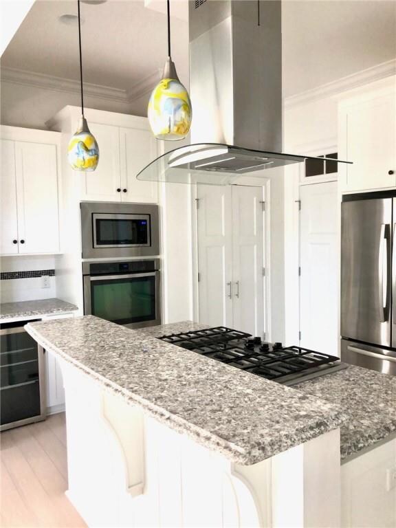Gas range, quartz countertops, beverage cooler and